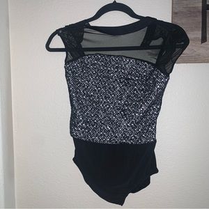 Revolution black dance leo w/mesh black overlay. Size XLC (extra large child)